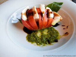 Insalata Caprese Beefsteak Tomatos with Fresh Mozzarella & Basil Infused Olive Oil.jpg